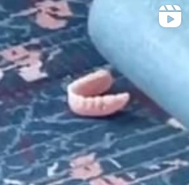 Denture piece laying on an airport floor