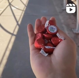 Chocolate kisses held out in a hand at EWR airport