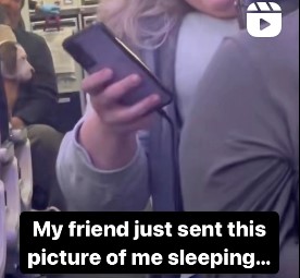A woman checking her phone. Her friend sent a picture of her sleeping. 