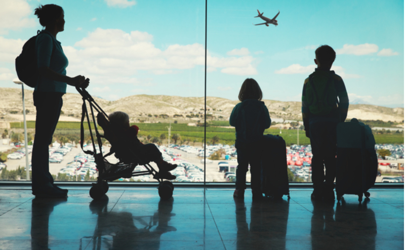 Family standing in an airport