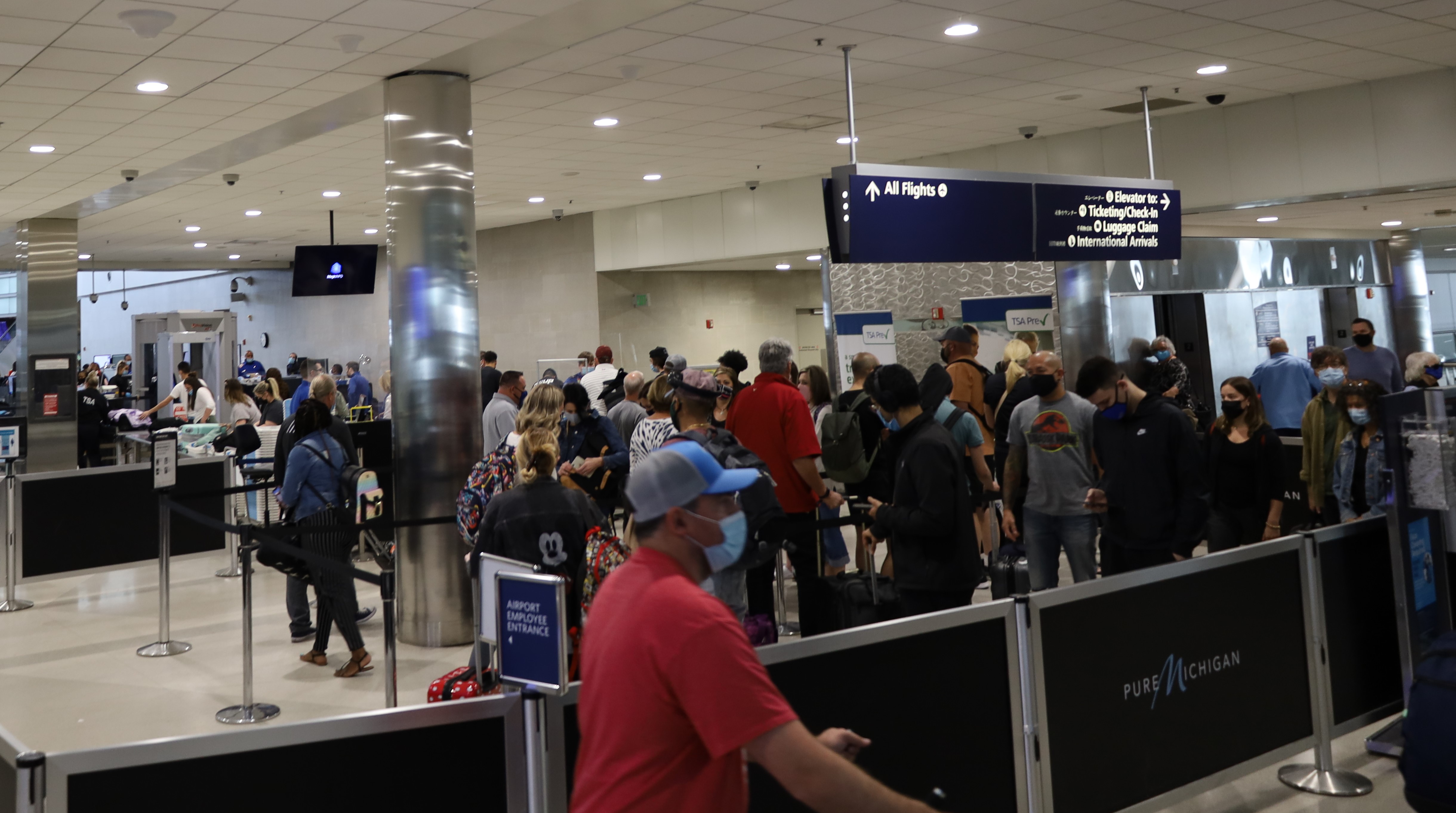 Passengers prepare to go through this TSA screening checkpoint at Detroit Metropolitan Wayne County Airport.