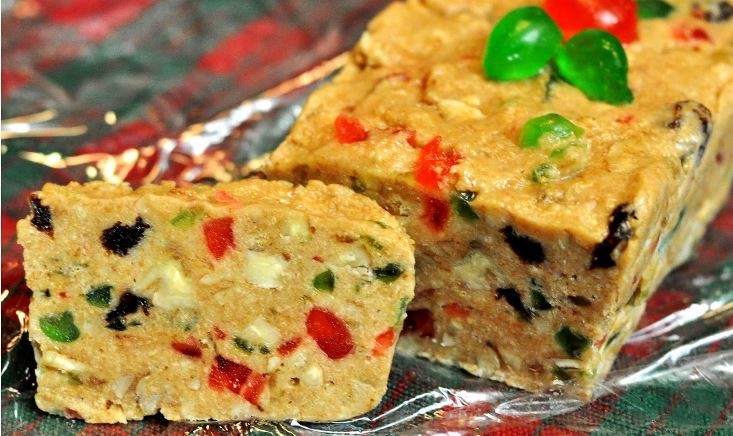 Fruitcake and other solid food items can be packed in a carry-on bag. Non-solid food items like egg nog, champagne and preserves are not solid and should be packed in a checked bag.