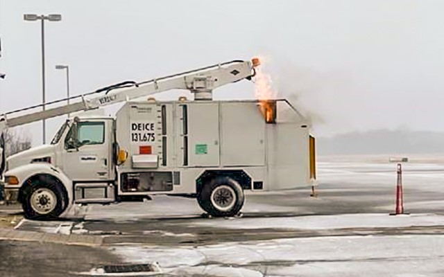 Flames shoot out of the back of a deicing truck near a ramp connected to a plane ready to take off at John Murtha Johnstown-Cambria County Airport (JST). (Photo courtesy of TSA JST)