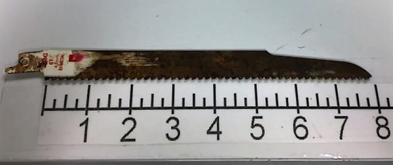 This saw blade was discovered concealed inside the lining of a carry-on bag at Milwaukee (MKE). 