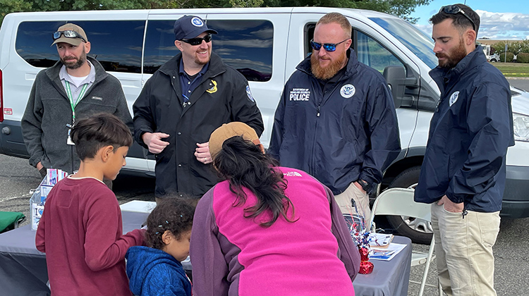 A Connecticut State Police Drone Unit officer shares a moment with a family at the child safety fair. (Photo by Janice Morton) 