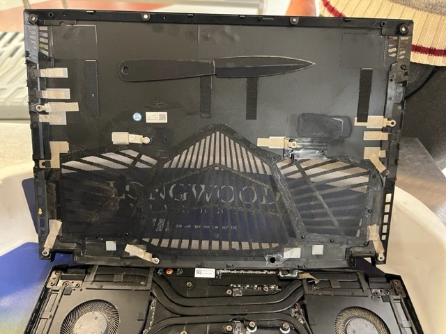 TSA officers at Richmond International Airport detected a knife artfully concealed inside a traveler’s laptop in November 2022. (TSA photos