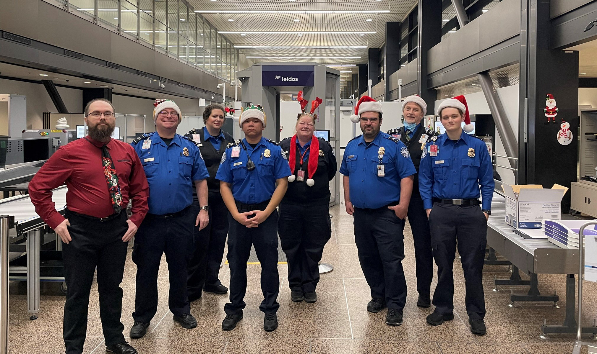 TSA team members at Seattle-Tacoma International Airport (SEA) who participated in Snowball Express and welcomed families of fallen soldiers at SEA. From left, TSA Manager BrookHunter Whelchel, TSA Officers Hayes Lanier and Jessica Smith, Lead Officer Richard Calalang, Supervisory Officer Teri Shoemaker, Officers Damacio Lopez, James Jaeger and Kyle Fancher. (Photo courtesy of TSA SEA)