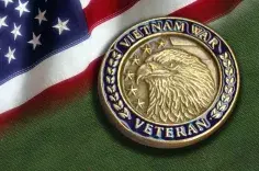 Vietnam War medal on U.S. flag background
