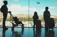 Family standing in an airport