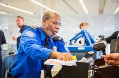 TSA Officer checks travel documents