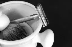 Shaving razor, brush, and mug. 