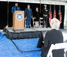 Enrollment Services and Vetting Programs Program Analyst Raul Diaz (at podium) serves as the master of ceremonies at TSA’s 2021 9/11 Ceremony, which commemorated the 20th anniversary of the terrorist attacks on September 11, 2001. (Photo by Bruce Milton) 