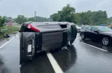 This SUV flipped over on Southern State Parkway about 10 miles from New York’s John F. Kennedy International Airport. (Photo by Richard White)