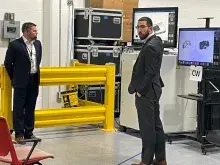 Erick Rekstad and Justin Keear demonstrate computed tomography X-ray scanning algorithms for TSA leadership and industry partners. (RCA photo)