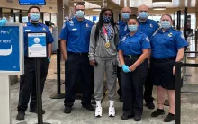Young with TSA officers photo