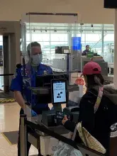 Touchless self-service technology at Indianpolis International Airport verifies the identity of passengers by taking a photo of the traveler and comparing it with the image on their ID.