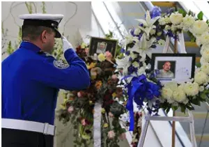 A TSA officer pays his respects to Los Angeles International Airport TSA Officer Gerardo Hernandez who lost his life in the line of duty on November 1, 2013. (TSA LAX photo)