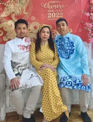 From left, Tim Lam (wearing a Ao Dai or a modernized Vietnamese traditional garment), with his mom Rose and brother at a Lunar New Year celebration (Photo courtesy of Tim Lam)