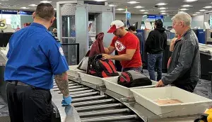Kansas City Chiefs fans go through TSA security at LAS after the Super Bowl. (Lorie Dankers photo)