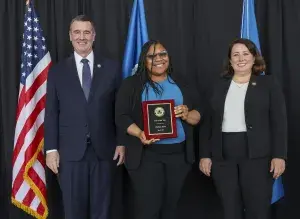 Administrator Pekoske and Senior Official Performing the Duties of the Deputy Administrator Stacey Fitzmaurice recognize Denver International Airport’s Chelsea Scott as Transportation Security Officer of the Year during the 2022 TSA Honorary Awards Ceremony. (Photo by Bruce Milton)