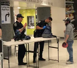 Police officers conduct a field assessment of the Pendar hand-held screening unit during a bag search at New York City’s Grand Central Terminal. (TSA photo)