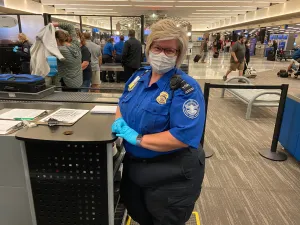 Eppley Airfield Lead TSA Officer Mindi York checks daily paperwork