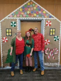 Lead Officer Ruth Harper, Officer Emily Mauss and Supervisory Officer Dude Cochran pose in front of TSA’s gingerbread house.  (Photos courtesy of TSA COD)