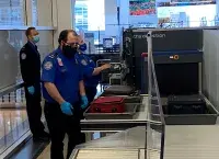 TSA officers touch screen photo