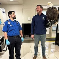 DCA STSO Jonathan Villatoro and bird handler Daniel Cone (Photo by Lisa Farbstein)