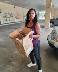 TSA Investigations Management Assistant Roxane Jett collects donations for the Atlanta Mission to help the city’s homeless population. (Photo courtesy of Roxane Jett)