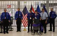 Luis Muñoz Marín International Airport officers pose with 101-year-old veteran at the inaugural Honor Flight. (Photo courtesy of Carlos Z. Cardona)
