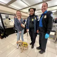 The TSA officers always enjoy working with the service dogs and their trainers. (TSA photo)