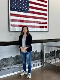 Alabama TSA Aviation Inspector Emily Flechas in the lobby of the TSA Systems Integration Facility in Arlington, Virginia. (Photo courtesy of Emily Flechas)