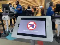 A sample of a sign posted in airports that reminds travelers that they are not to bring guns to checkpoints.