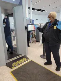Officer Bean screens passenger photo