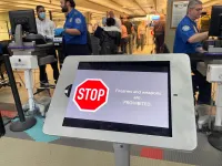 One of two electronic signs at the entrance to the main checkpoint at Pittsburgh International Airport to remind travelers not to bring their gun into the checkpoint. (TSA photo)