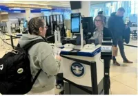 A ROC traveler waits while the tablet captures her photo to immediately verify that her face matches the face on her ID. (TSA photo)