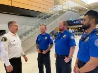 Fire Chief with TSA officers photo