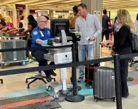 Travelers should place items from their pockets directly into their carry-on bags. (TSA photo)