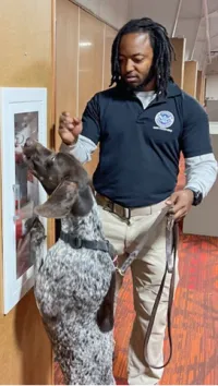 TSA Training Instructor Solomon Day with a canine at the TSA Canine Training Center (TSA photo)