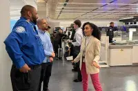 Newark Liberty International Airport TSA Manager Ilary Hernandez (right) discusses the day’s security operations with Supervisory Officer Anthony Perez and fellow TSA Manager Jose Jaquez. (Photo by Ana Correa)