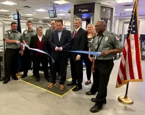 TSA, airport security officers and airport officials cut the ribbon to celebrate the new computed tomography scanners and credential authentication technology units that are now in use at Atlantic City International Airport. (TSA photo)