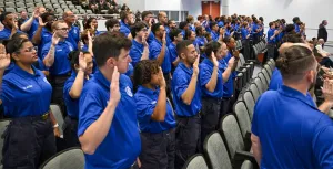 Basic Training Program graduates take the oath of office. (Photo courtesy of TSA T&D)