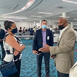 Dwaine Murray explains new checkpoint technologies for the Ambassador of the Bahamas with TSA Representative Scott Byers and Preclearance Branch Manager Adrien McDonald. (Photo provided by Dwaine Murray)