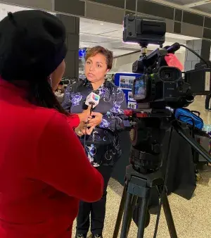 Patricia Mancha speaks with an Hispanic reporter. (TSA photo)