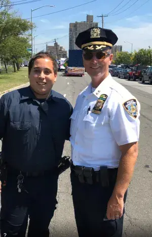 Albert Torres with New York Police Department chief at a community parade. (Photo courtesy of Albert Torres)