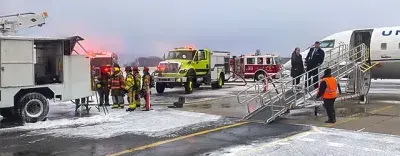 Firefighters and police from Richland Township, Pennsylvania, respond to a deicing truck fire at John Murtha Johnstown-Cambria County Airport (JST). TSA officers arrived first on the scene with fire extinguishers to control the flames. (Photo courtesy of TSA JST)