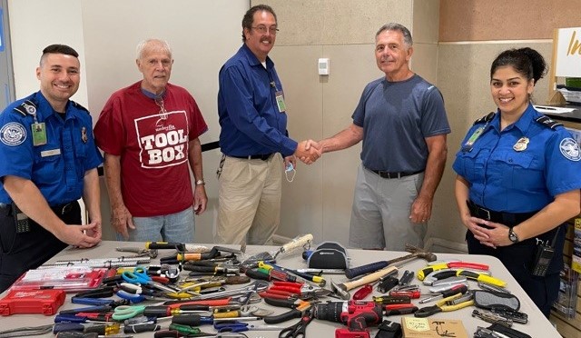 TSA officials at Albany International Airport donated 75 pounds of tools to representatives of The Tool Box. (TSA photo)